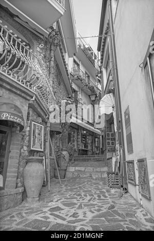 CASTELMOLA, ITALY - APRIL 9, 2018: The little main squere of the town with the shops. Stock Photo