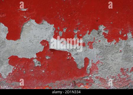 Peeled paint of old red wall, texture or background Stock Photo