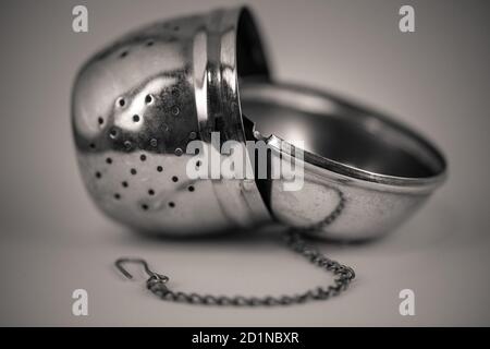 monocrome macro shot of a metal tea strainer, kitchen Stock Photo