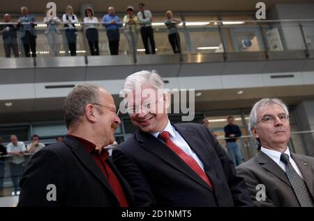 Opel Chief Executive Hans Demant C State Premier Of Hesse Roland Koch L And Opel Chairman Of The Board Carl Peter Forster Talk At The Production Site Of German Car Manufacturer In Ruesselsheim September