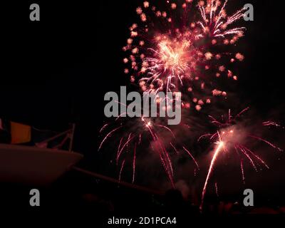 Burning sparklers on black background. Small fireworks giving off sparks of fire. Sparks explosion. During Armada exhibition in France Stock Photo