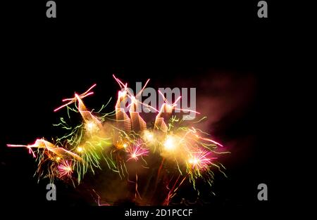 Burning sparklers on black background. Small fireworks giving off sparks of fire. Sparks explosion. During Armada exhibition in France Stock Photo