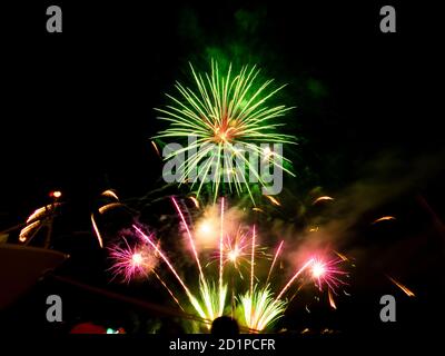 Burning sparklers on black background. Small fireworks giving off sparks of fire. Sparks explosion. During Armada exhibition in France Stock Photo
