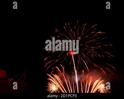 Burning sparklers on black background. Small fireworks giving off sparks of fire. Sparks explosion. During Armada exhibition in France Stock Photo