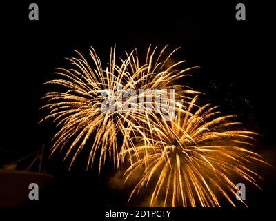 Burning sparklers on black background. Small fireworks giving off sparks of fire. Sparks explosion. During Armada exhibition in France Stock Photo