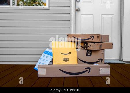 Calgary, Alberta, Canada. Oct 4, 2021. Amazon deliver boxes and envelopes at a home entrance just delivered. Stock Photo