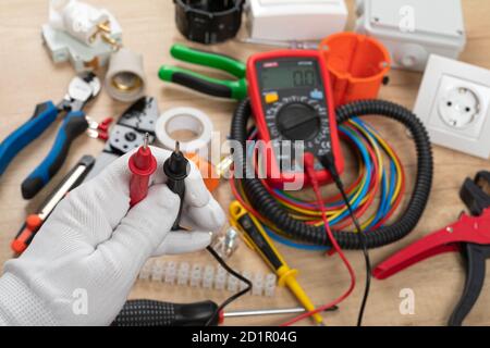 Tools for electrician needs: shocket multimeter, voltage testers, wire strippers, pliers, Stock Photo