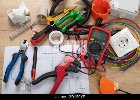 Tools for electrician needs: shocket multimeter, voltage testers, wire strippers, pliers, Stock Photo