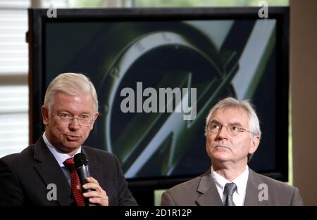 Opel Chief Executive Hans Demant C State Premier Of Hesse Roland Koch L And Opel Chairman Of The Board Carl Peter Forster Talk At The Production Site Of German Car Manufacturer In Ruesselsheim September