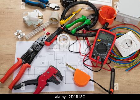 Tools for electrician needs: shocket multimeter, voltage testers, wire strippers, pliers, Stock Photo