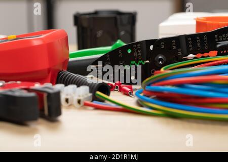 Tools for electrician needs: multimeter, voltage testers, wire strippers, pliers, Stock Photo