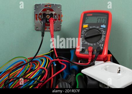 Tools for electrician needs: shocket multimeter, voltage testers, wire strippers, pliers, Stock Photo