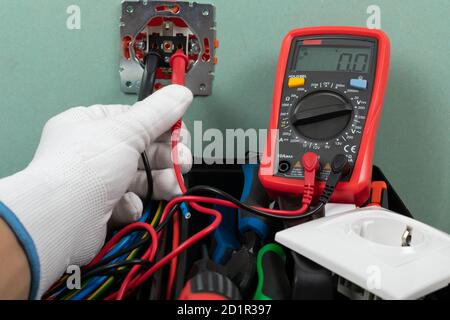 Tools for electrician needs: shocket multimeter, voltage testers, wire strippers, pliers, Stock Photo