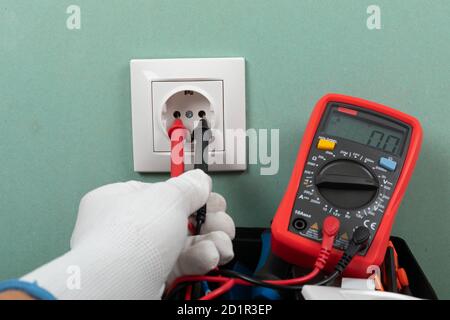 Tools for electrician needs: shocket multimeter, voltage testers, wire strippers, pliers, Stock Photo