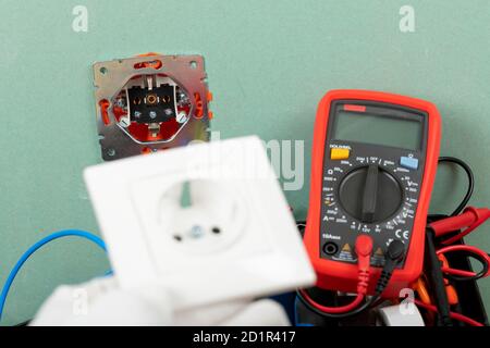 Tools for electrician needs: multimeter, voltage testers, wire strippers, pliers, Stock Photo