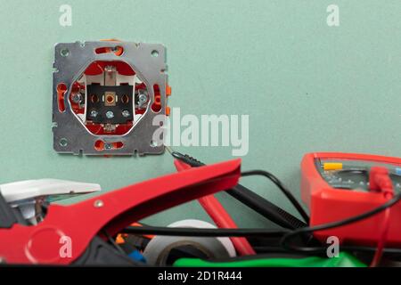 Tools for electrician needs: multimeter, voltage testers, wire strippers, pliers, Stock Photo