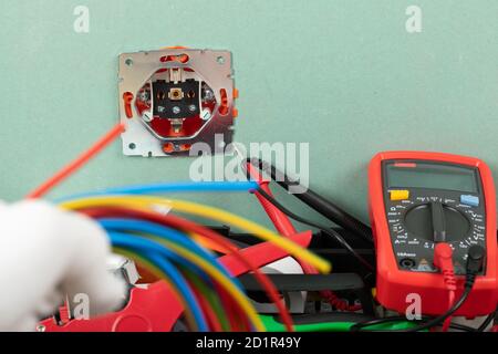 Tools for electrician needs: multimeter, voltage testers, wire strippers, pliers, Stock Photo