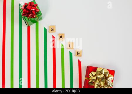 Word SALE with gift boxes on color background. flat lay. Online shopping concept Stock Photo
