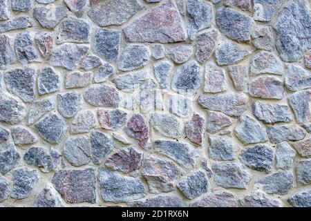 Gray and blue stone wall texture, old floor background. Natural rock floor, pattern. Brick surface, frame. Grunge cement structure. An element of arch Stock Photo