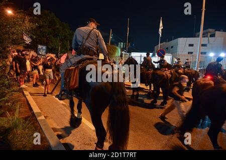 2.10.2020 Tel Aviv, Israel. Protest against Prime minister Netanyahu and second Coronavirus lockdown. Police horses were used to block the protestors from crossing LaGardia street in Tel Aviv, and were guided to use force while pushing the protestors by police horseman