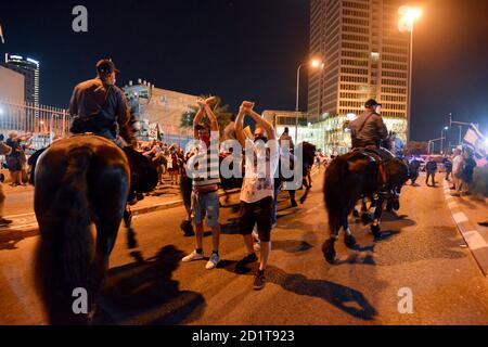2.10.2020 Tel Aviv, Israel. Protest against Prime minister Netanyahu and second Coronavirus lockdown. Police horses were used to block the protestors from crossing LaGardia street in Tel Aviv, and were guided to use force while pushing the protestors by police horseman