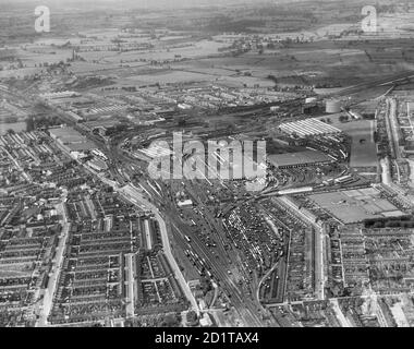 SWINDON, Wiltshire. The Great Western Railway Works, Swindon station and the workers village (Swindon New Town), looking west. Photographed in August 1938. Aerofilms Collection (see Links). Stock Photo