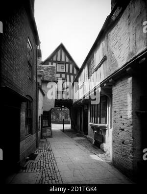 ABBOT REGINALD'S GATE, Old Rectory, Evesham, Worcestershire. The Norman Gateway, which links the town and the abbey cemetery, with the timber framed rectory in the foreground, taken from the market place. Photographed by Henry Taunt (active 1860 - 1922). Stock Photo