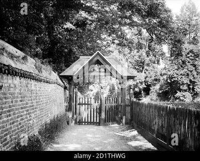 ST ANDREWS CHURCH, Sonning, Berkshire. The wooden lych gate of the church, built in the Victorian period, with a narrow lane behind. Photographed by Henry Taunt (active 1860 - 1922). Stock Photo