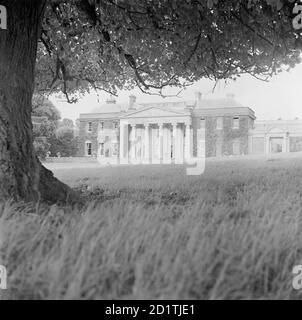 TRELISSICK, Feock, Cornwall. The entrance front of Trelissick, Feock, with its pedimented portico. It was built by P F Robinson circa 1825. Pevsner called it 'the severest neo-Greek mansion in Cornwall'. Photographed by Eric de Mare between 1945 and 1980.