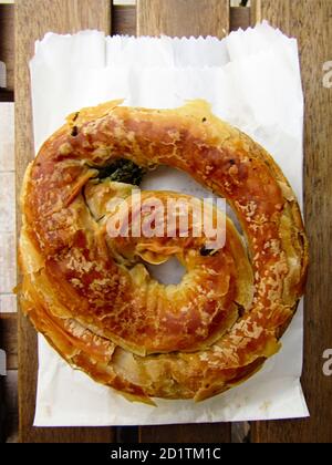 Traditional Greek Food. Roind Shaped Spanakopita ( Spinach and Cheese Pie ) Stock Photo