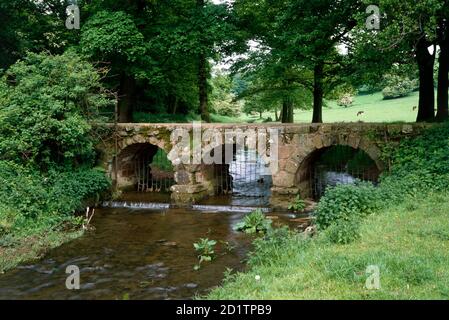 BOW BRIDGE, Barrow-in-Furness, Cumbria. View of the bridge looking North.  This narrow 15th century stone bridge across Mill Beck carried an old packhorse route to nearby Furness Abbey. Stock Photo