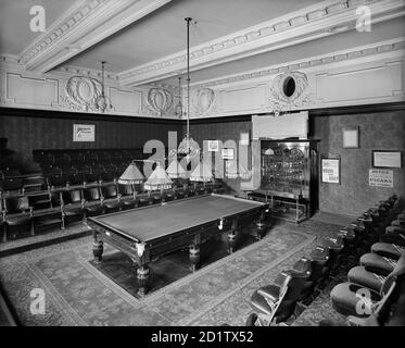 THURSTON'S BILLIARD HALL, Leicester Square, London. Interior of the match room, with seating for spectators. Numbers 45 and 46 Leicester Square were rebuilt in 1902 to 1903 to the designs of E Wimperis & East, for Thurston and Company, billiard table makers and billiard hall, who commissioned this photograph. Taken on 3rd June 1903 by Bedford Lemere & Co. Stock Photo