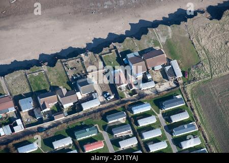 Bungalows on Green Lane at risk of further coastal erosion, near Skipsea, East Riding of Yorkshire, 2014, UK. Aerial view. Stock Photo