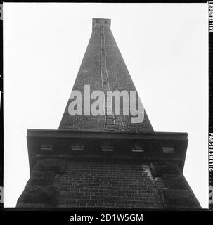 A view looking up to the summit of the chimney at Salt's Mill, Victoria Road, Saltaire, Shipley, Bradford, West Yorkshire, UK. Stock Photo