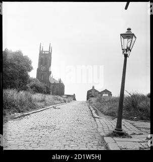 A view looking along St Mary's Street towards St Mary's Church with a lamp post in the foreground, Quarry Hill, Leeds, UK. Stock Photo