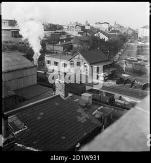 An elevated view looking down onto railway tracks and Pay Office. Stock Photo