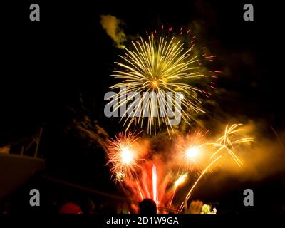Burning sparklers on black background. Small fireworks giving off sparks of fire. Sparks explosion. During Armada exhibition in France Stock Photo