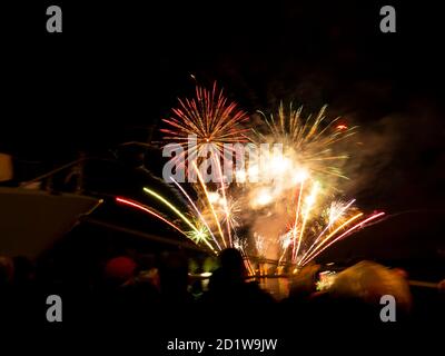 Burning sparklers on black background. Small fireworks giving off sparks of fire. Sparks explosion. During Armada exhibition in France Stock Photo