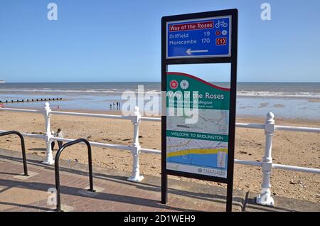 A signpost for the Way of The Roses Cycle Route between Driffield and Morecambe, in Bridlington, Yorkshire Stock Photo