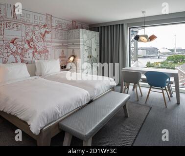 A bedroom suite overlooking the river Clyde, Glasgow, Scotland, UK,  in the 174-room Radisson RED Hotel. Stock Photo