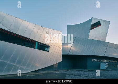 Imperial War Museum North, which represents a shattered globe, was the first building in the UK by Daniel Libeskind. Built on a bomb site, it was completed in 2002 in Salford Quays, Manchester, England, UK. Stock Photo