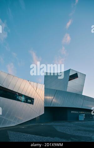 Imperial War Museum North, which represents a shattered globe, was the first building in the UK by Daniel Libeskind. Built on a bomb site, it was completed in 2002 in Salford Quays, Manchester, England, UK. Stock Photo