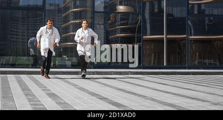 in full growth. medical professionals running to the rescue. Stock Photo