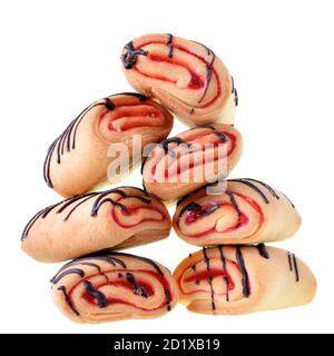 Cookies rolls with strawberry jam and chocolate icing isolated on a white background. Stock Photo