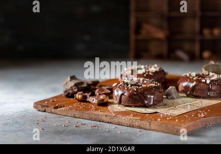 Chocolate donuts with chocolate glaze, nuts. National Donut Day. Homemade baking. Stock Photo