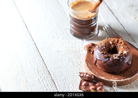 Chocolate donuts on a white wooden background. National Donut Day. Homemade baking. Stock Photo