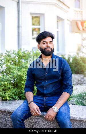 Fashion business man in shirt posing in the street. Stock Photo