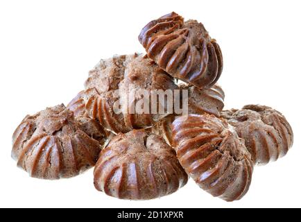 Heap of freshly baked brown eclairs isolated on a white background. Stock Photo