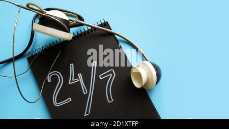 24 7 customer service and support concept and retro headset. Stock Photo