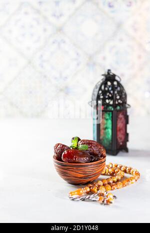 Plate with dates, Muslim lamp and decorative crescent for Ramadan on ...